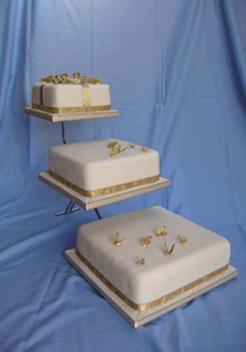 square wedding cake on a stand