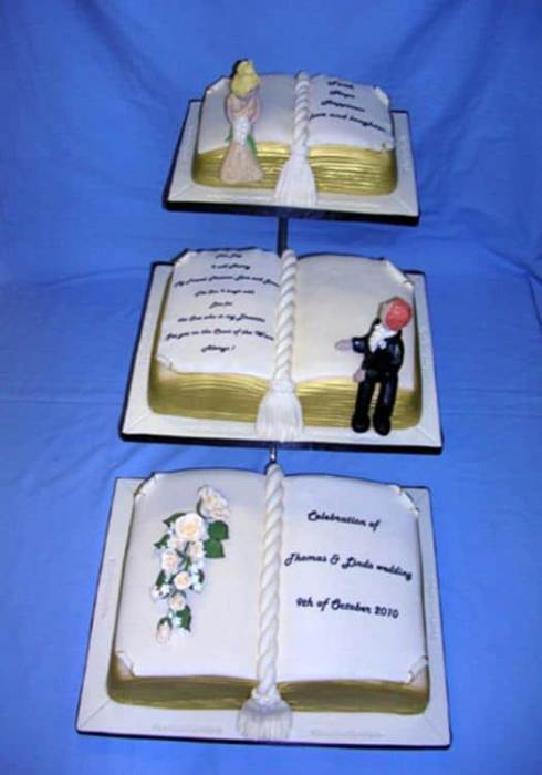 3x book wedding cake on a stand