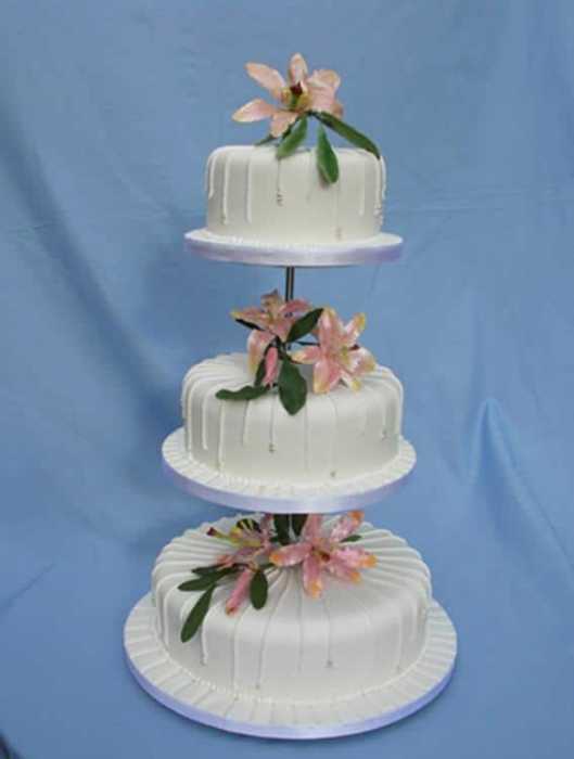 Wedding cake royal icing drip and Lillie flowers