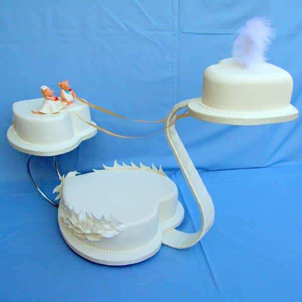swan wedding cake on a stand