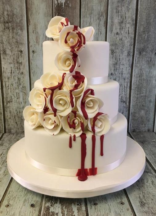 rose wedding cake with dripping red blood