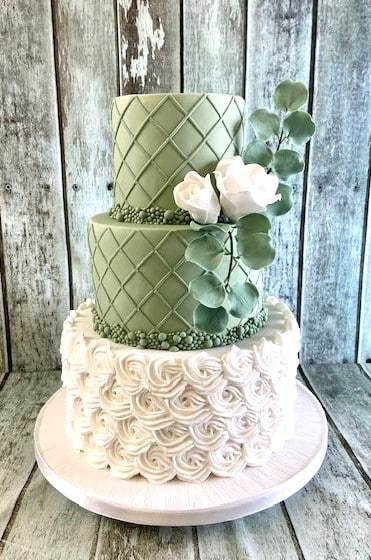 sage-green-trellis-with-rosettes-and-silk-flowers-wedding-cake-