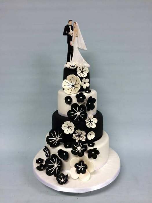 Black and white wedding cake with sugar flowers flowers