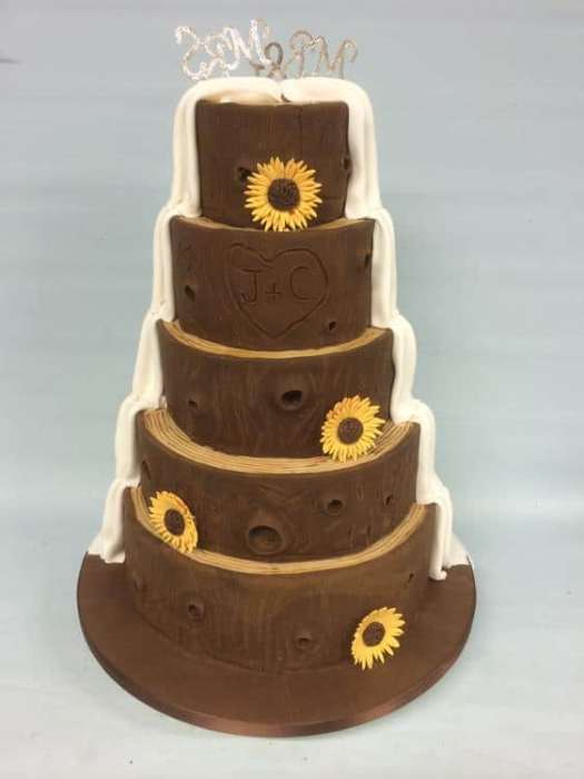 wedding cake split tree trunk with sunflowers