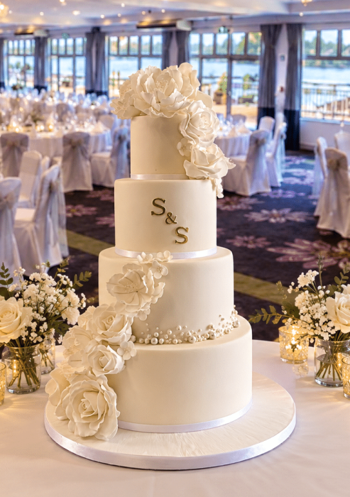 white-wedding-cake-with-vintage-cascading-roses-and-sugar-pearls