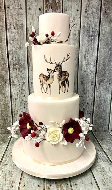 winter-hand-painted-Deer-with-sugar-flowers-wedding-cake-