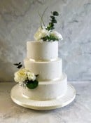 Royal icing hand piped pearls wedding cake with silk flowers 