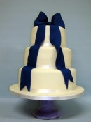 wedding cake with sugar draping bow