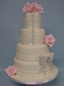 pearl buttons and lace wedding cake