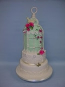 vintage green bird cage wedding cake