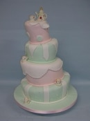 topsy turvy wedding cake in pastel colours