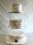 Delicate-cherry-blossoms-wedding-cake-on-a-stand