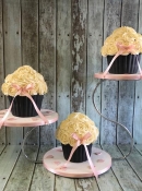 3 big muffin wedding cakes on a stand