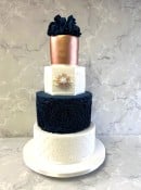 Victorian-navy-rosettes-and-pearls-wedding-cake-