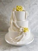 White-satin-drape-wedding-cake-with-sugar-roses-