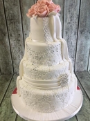 diamond brooch and lace dress wedding cake
