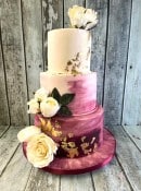 hand-painted-iced-wedding-cake-with-gold-leaf-and-silk-flowers-