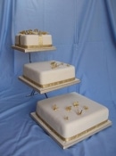 square wedding cake on a stand