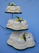 3 x petal shaped wedding cake on a stand