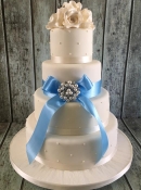 pearl and satin bow wedding cake