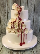 rose wedding cake with dripping red blood