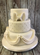 sugar brooch and swag wedding cake