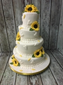 topsy turvy sunflower wedding cake