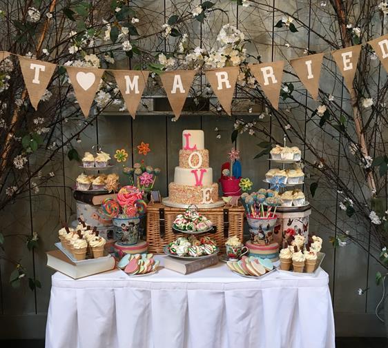 Vintage  wedding cake table and treats table seaside theme