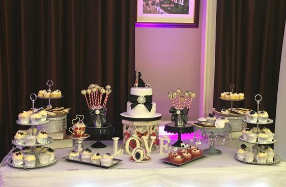Vintage wedding  cake table and treats table glitz sand glamour